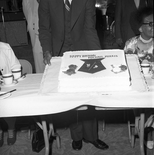 Michael Morris standing with his birthday cake, Compton, ca. 1974