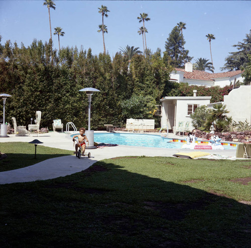 Berry Gordy's house party guests by the pool, Los Angeles