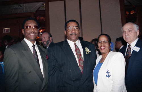 Willie Williams posing with others at an event to welcome him, Los Angeles, 1992