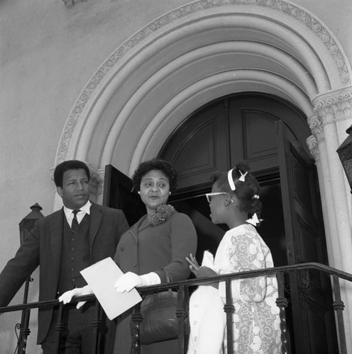 Frank Holoman standing with a woman and young girl, Los Angeles, 1969