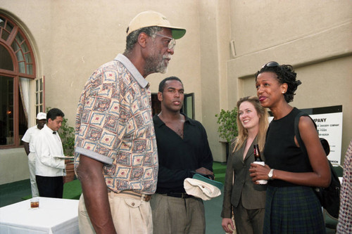 Bill Russell talking with people during the Jackie Robinson Foundation Golf Classic, Los Angeles, 1994