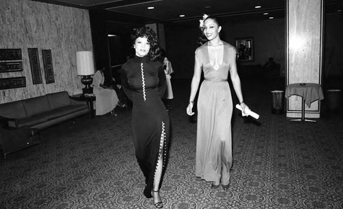 Production hostesses walking along a corridor during the NAACP Image Awards, Los Angeles, 1978