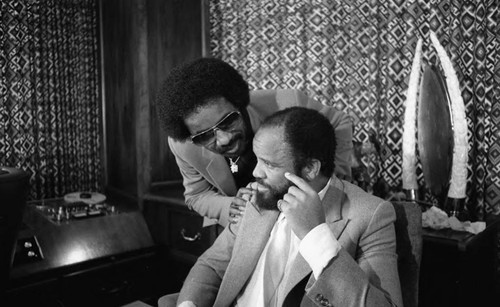 Stevie Wonder talking with Berry Gordy in his office, Los Angeles, 1982