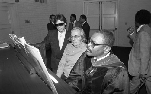 Organist playing while others watch, Los Angeles, 1987