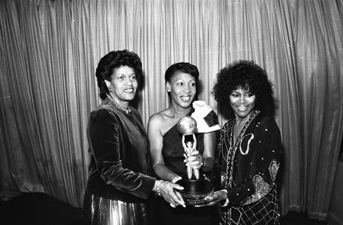 Myrlie Evers-Williams, Maxine Waters and Cicely Tyson holding an award at the NAACP Image Awards; Los Angeles, 1981