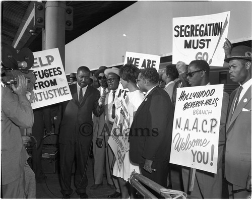 Civil rights workers talking to the media at Union Station, Los Angeles, 1962