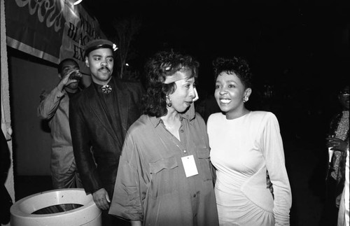 Anita Baker talking with a woman at the 11th Annual BRE Conference, Los Angeles, 1987