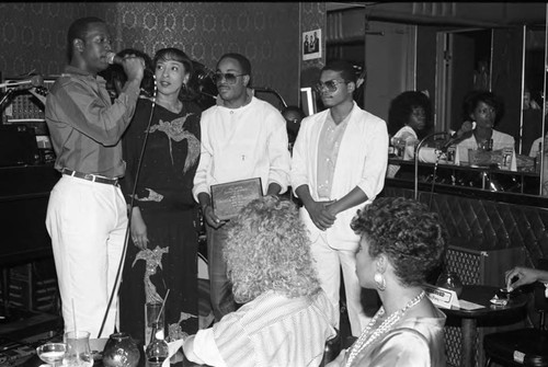 Cedric Napoleon speaking into a microphone at the Pied Piper nightclub, Los Angeles, 1986