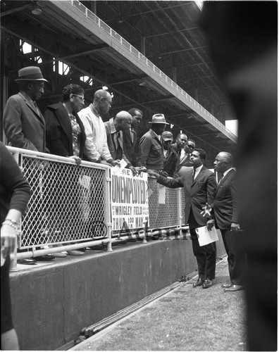 Conference of the Unemployed attendees talking with Mervyn Dymally and Gilbert Lindsay, Los Angeles, 1964