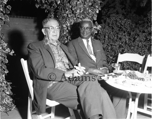 Dr. H. Claude Hudson sitting with an unidentified man, Los Angeles, 1963