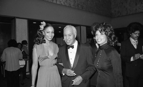 Roy Wilkins posing with award presenters during the NAACP Image Awards, Los Angeles, 1978