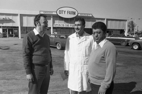 City Farm market representatives standing together in their parking lot, Los Angeles, 1986