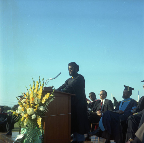 Speaker addressing the audience during Compton College commencement, Compton, 1972