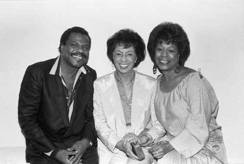 Gertrude Gipson posing with Billy Preston and Merry Clayton at the Pied Piper nightclub, Los Angeles, 1984