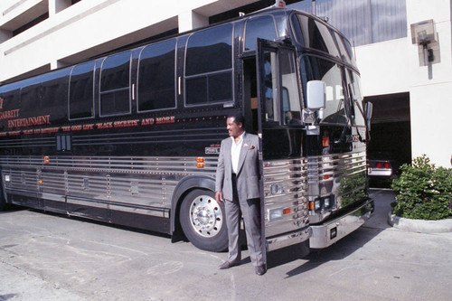 Shelly Garrett standing next to his bus, Los Angeles