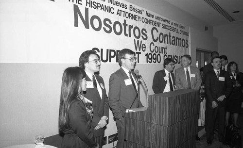 ABA meeting participants standing near a "Nosotros Contamos" banner, Los Angeles,1990