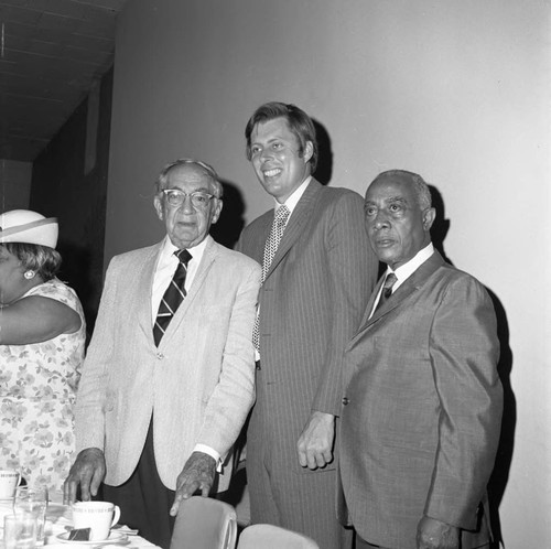 Dr. H. Claude Hudson, Gilbert Lindsay, and John Tunney posing together at the new Kearny Post Office opening, Los Angeles, 1972