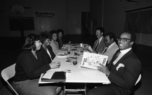 Crenshaw Family YMCA Current Support Campaign participants sitting together, Los Angeles, 1983