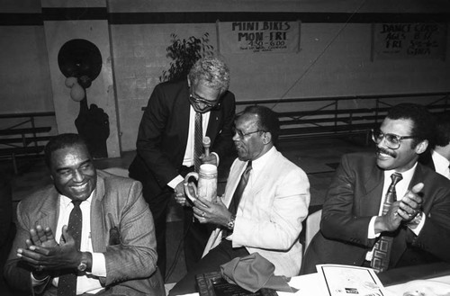 Brad Pye Jr. receiving a gift during the Black Athletes Hall of Fame dedication, Los Angeles, 1984