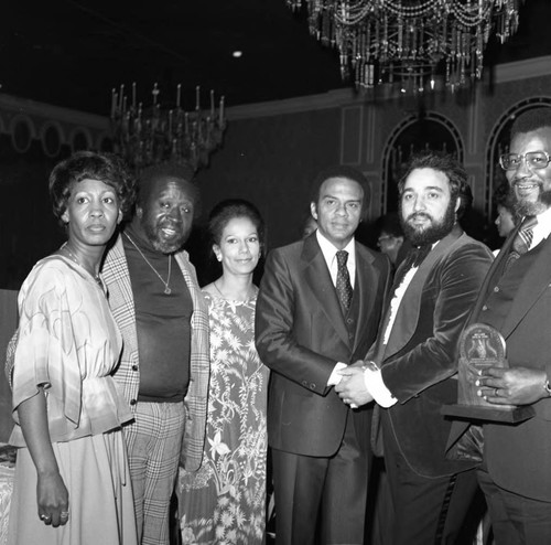 Brotherhood Crusade dinner participants posing together at the Beverly Hills Hotel, Los Angeles, 1978
