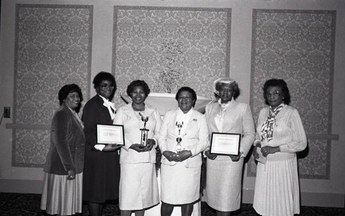 Alpha Lambda Chapter, Theta Mu Sigma members holding awards, Los Angeles, 1983