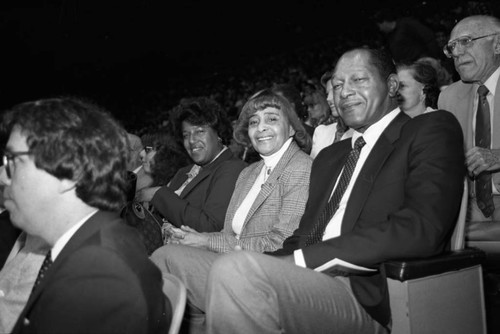 Tom Bradley sitting with Ethel Bradley and Lorriane Bradley at the NBA All-Star Game, Inglewood, California, 1983