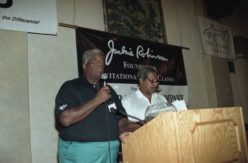 Men standing at a lectern during the Jackie Robinson Foundation Golf Classic awards dinner, Los Angeles, 1994