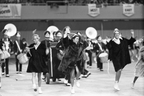 Marching band and drill team members performing during a LAUSD competition, Los Angeles, 1983