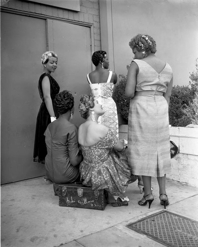 Hair models posing outside at Ciro's during a fashion and hair show, Los Angeles, 1957