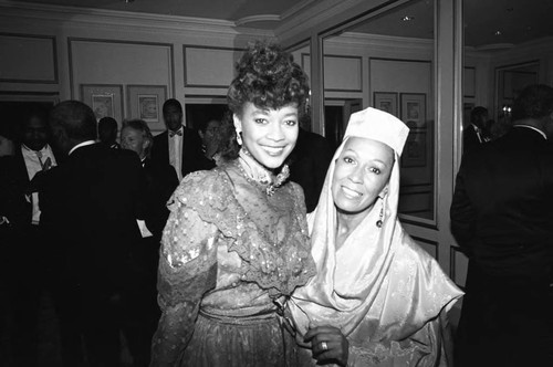 Cindi James Gossett posing with an actress at the Black Emmy nominees dinner, Los Angeles, 1989