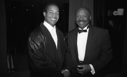 Willie Brown and an unidentified African American man posing for the camera, Los Angeles, 1989