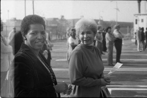 Two women posing together at the opening of the Martin Luther King Jr. Shopping Center, Los Angeles, 1984