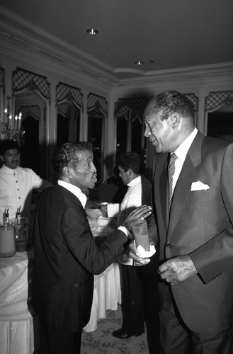 Sammy Davis Jr. talking with Tom Bradley at the Black Emmy nominees dinner, Los Angeles, 1989