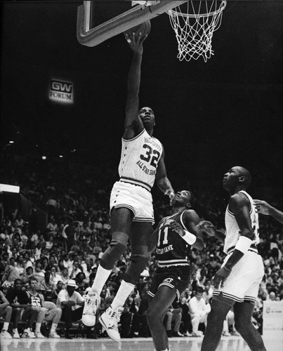 Magic Johnson leaping for a basket, Los Angeles, 1989