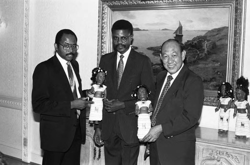 Men displaying Black dolls at the Bel Age Hotel, Los Angeles, 1986