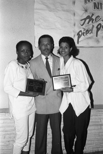 Flynn Pryor posing with an award at the Pied Piper nightclub, Los Angeles, 1989