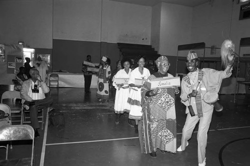 Men and women forming a procession during the annual African festival, Los Angeles, 1986