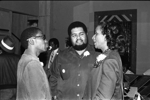 Ernest Thomas talking with a couple at a Sickle Cell Radio-Thon, Los Angeles, 1984