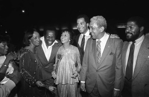 Reve Gipson and Gertrude Gipson pose with Lou Rawls and others at the Pied Piper nightclub, Los Angeles, 1984