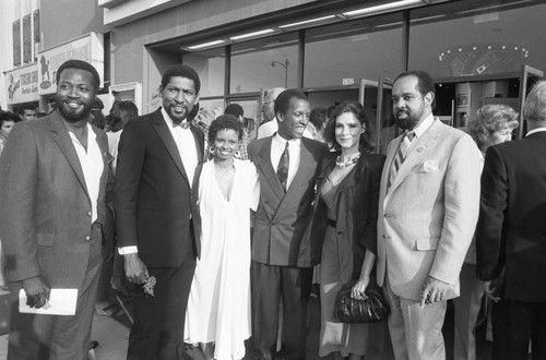 Guests at the premiere of "The Jesse Owens Story" posing together, Los Angeles, 1984