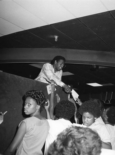 Al Green signing autographs at World on Wheels, Los Angeles, 1983