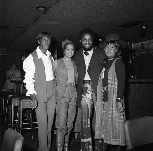 Gwen Gordy Fuqua posing with others at a nightclub, Los Angeles