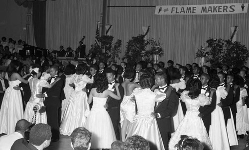 Young African American men and women dancing in a ballroom, Los Angeles, 1987