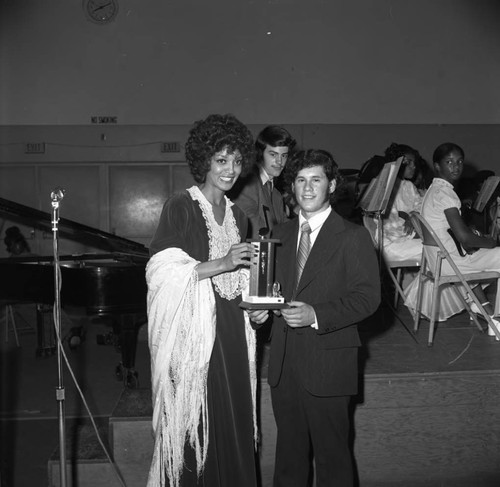 Vonetta McGee presenting a scholarship award during a Compton Civic Youth Orchestra concert, Compton, 1973