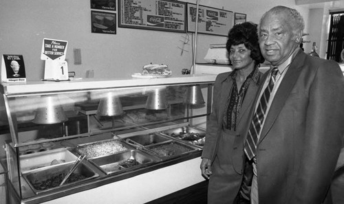 Frankie and Douglas Bell posing together in their restaurant, Los Angeles, 1984