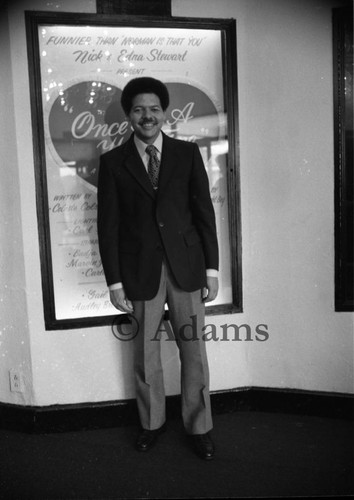 Man in front of poster, Los Angeles, 1866