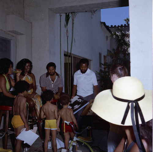 Berry Gordy with guests at his house party, Los Angeles