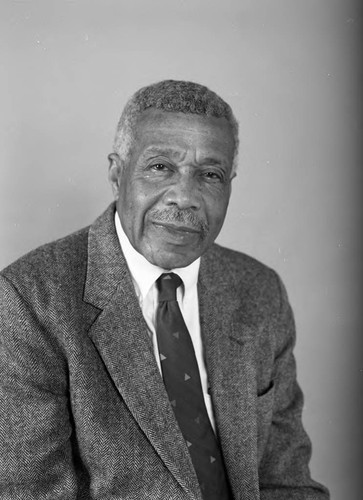 Dr. Earl Claiborne posing for a studio portrait, Los Angeles, 1990