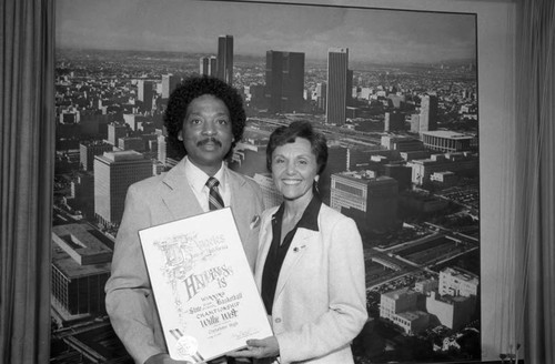 Willie West receiving a commendation from Pat Russell, Los Angeles, 1983