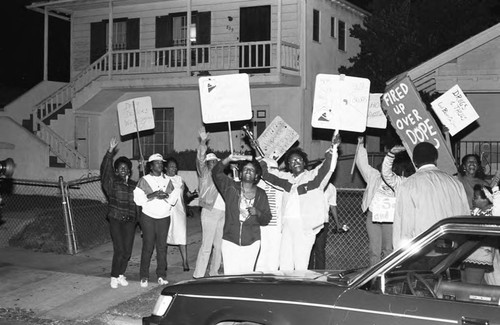 Neighborhood watch group marching against drugs and crime, Los Angeles, 1986